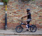 Side profile of Eole X Pro electric bike parked on city street.
