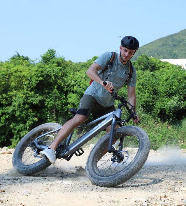 A man riding the Vanpower Electric bike in the field. Suitable for mountain biking