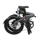 Folded Eole X electric bike in black, highlighting its portable design and ease of storage for city living.