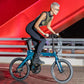Urban cyclist riding the Fiido X ebike at night, demonstrating its portability and city-ready design.