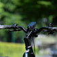 Close-up of the Lapis ebike handlebar with LCD display, ergonomic grips, and control buttons, emphasising the bike's advanced technology.