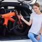 Compact Eole S electric bike folded neatly in a car trunk, emphasizing its portability and travel-friendly design.