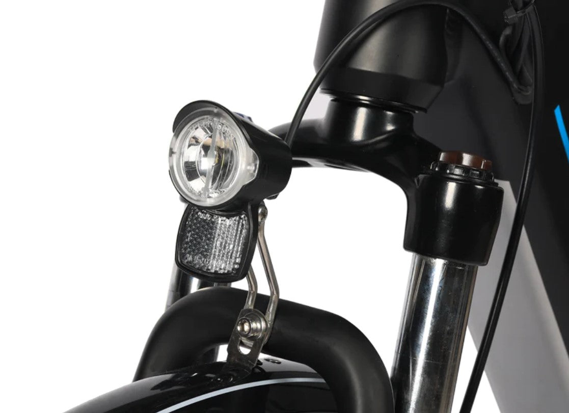 Front headlight and reflector on Eskute Polluno Pro eBike for night safety.