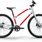 Two-tone red and white Ref Essential bike profile, highlighting its lightweight frame and for easy travel.