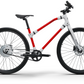 Red and white Essential Boost bicycle, ideal for urban commuting.
