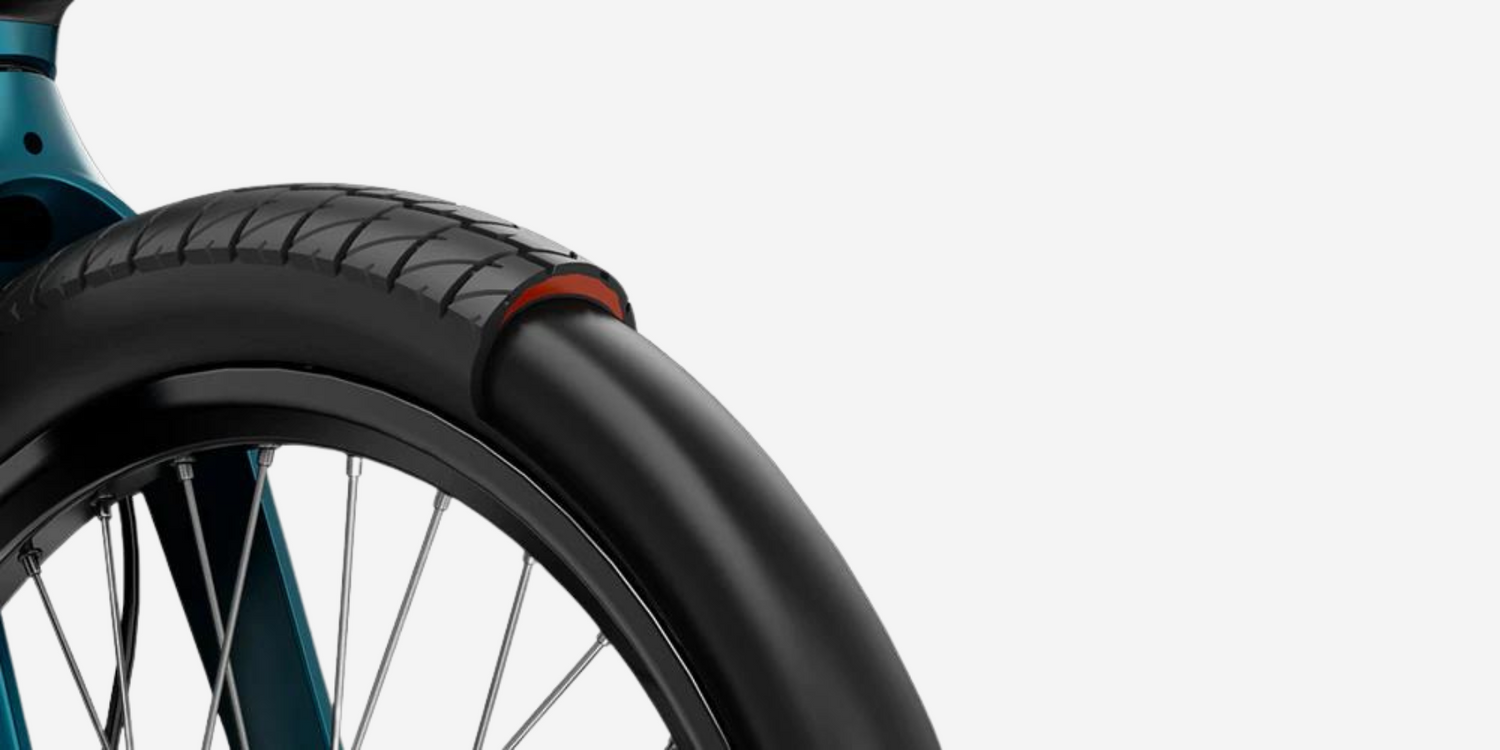 A close up of the tires of an electric bike.