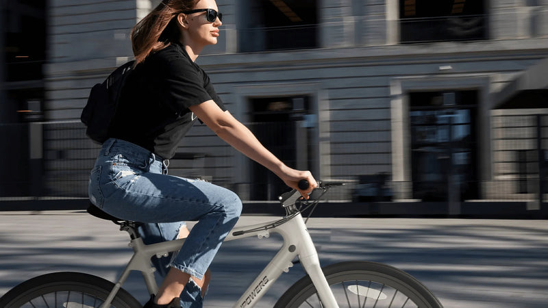 A woman commuting on the Vanpower City Vanture ebike in the city.